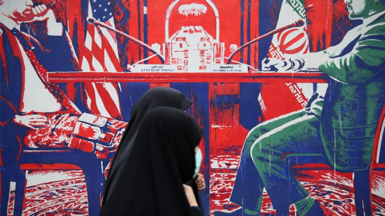 A mural on the outer walls of the former US embassy in Tehran depicts two men in negotiation.