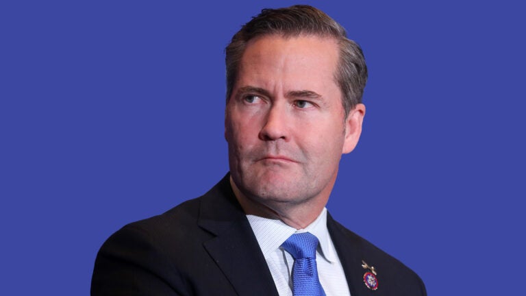 Portrait of Mike Waltz against a blue background.